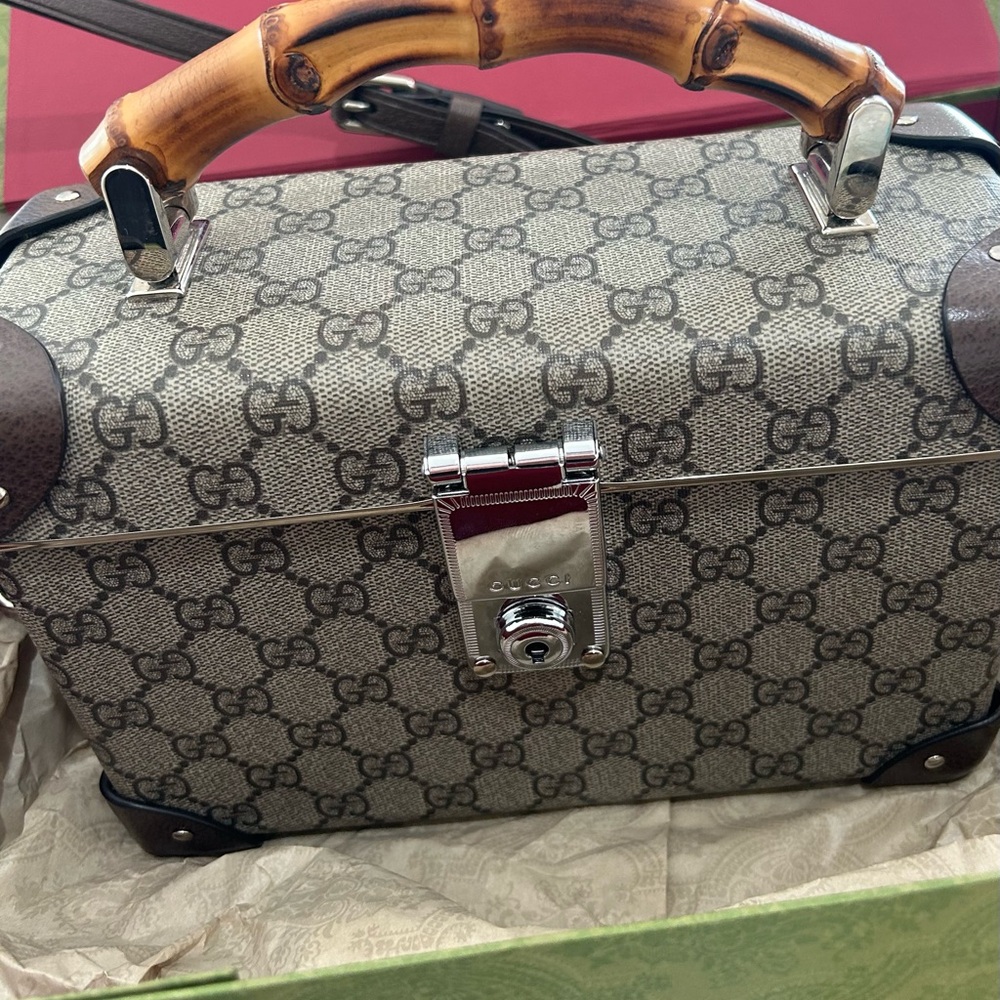 GUCCI Authentic Monogram Globetrotter Handbag.